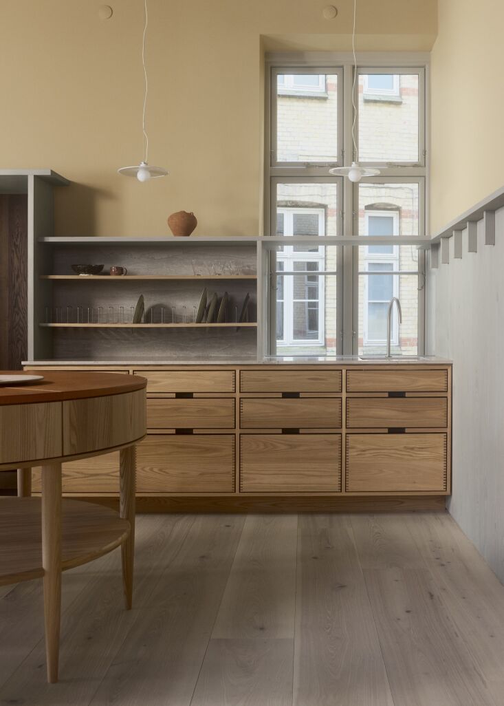 Dinesen wood paneling finished in Ash Oil against Sahara Sand walls and Mississippi Mud trim.