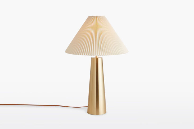 The sleek Barden Taper Table Lamp on a bistro table.