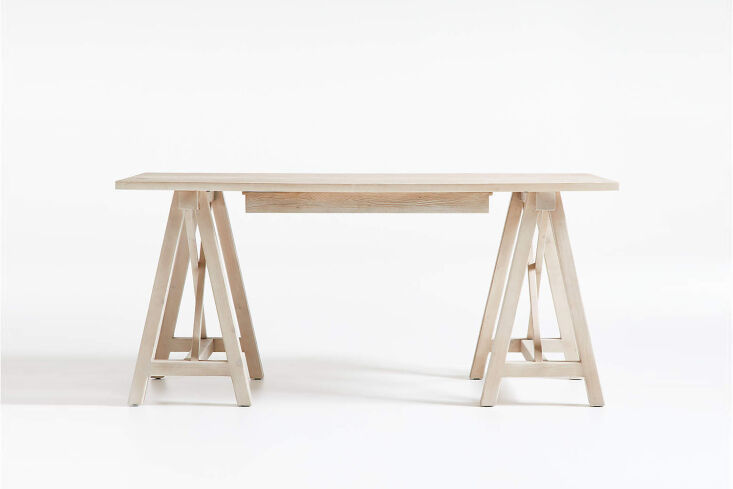 Minimalist pine wood desk with clean lines and a matching stool.