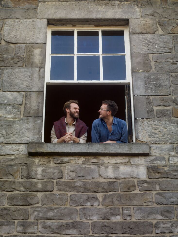 Founders James Stevens and Hugo Macdonald standing together inside their gallery.
