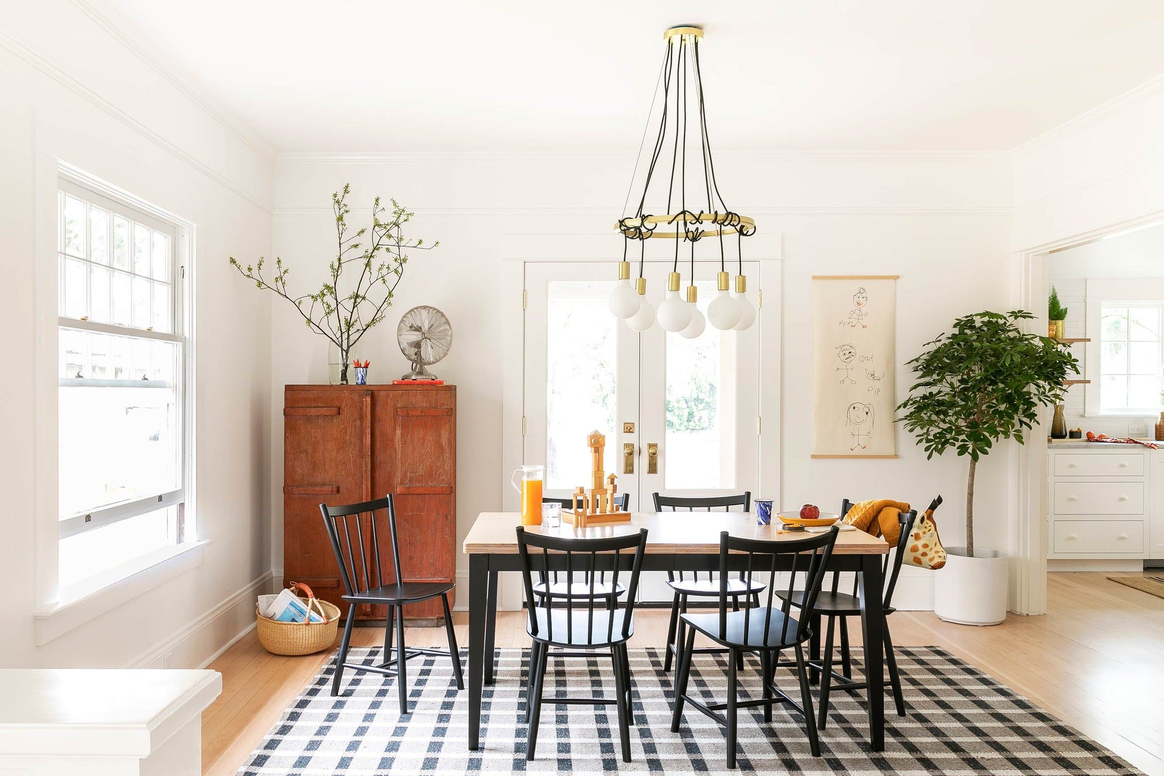 Graphic text overlaying a clean interior background titled Our Top 3 Unconventional Tips for Tidying.