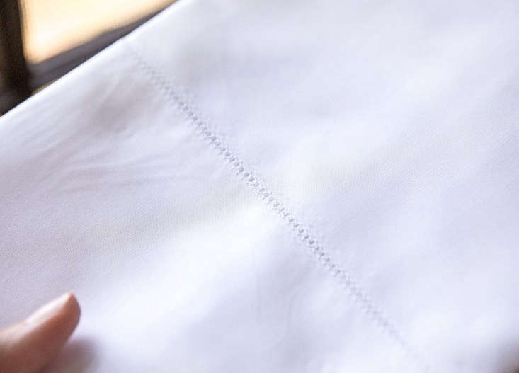 Detail of the smooth, high-thread-count finish on a Sferra sheet.