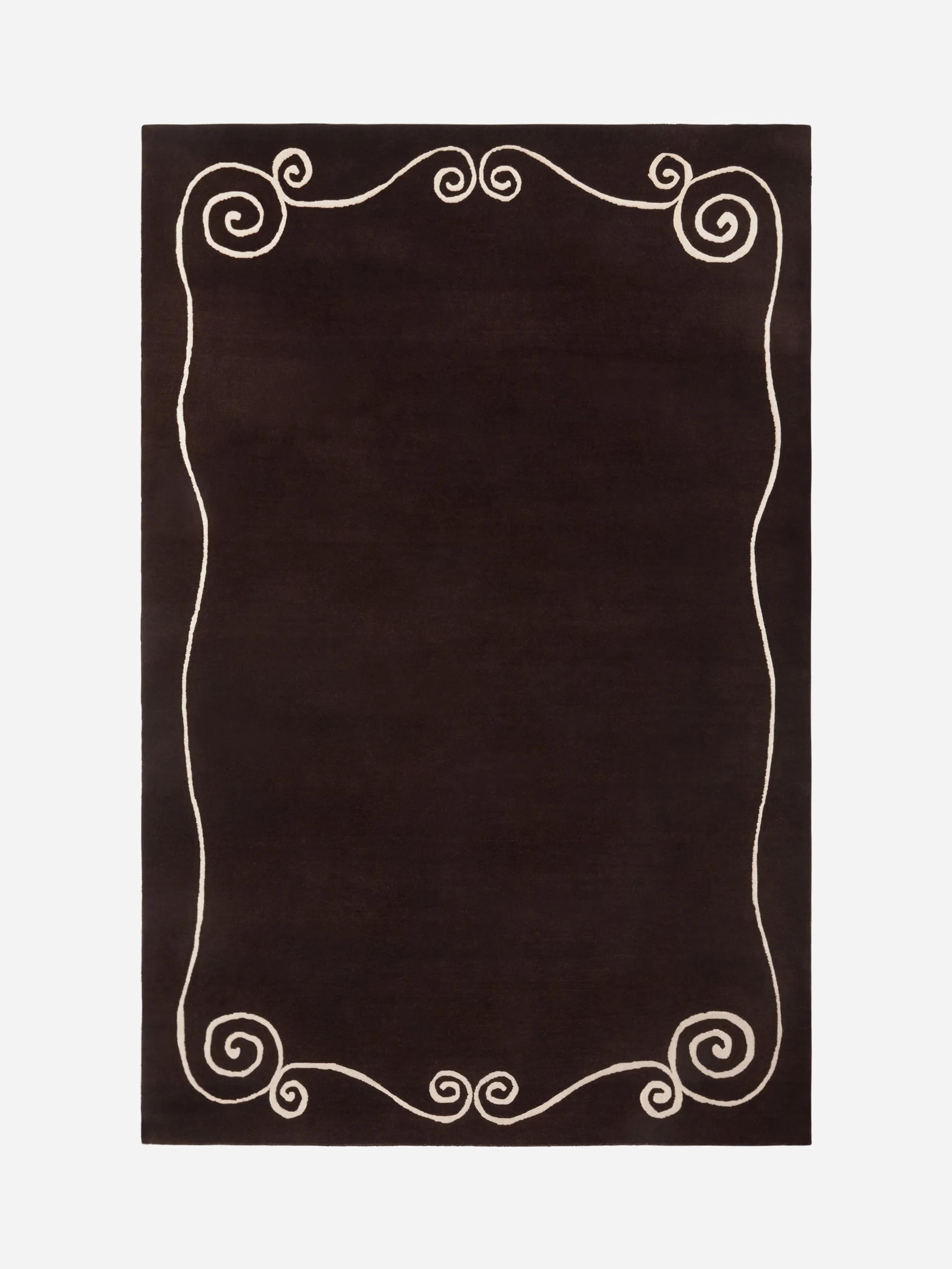 A rich espresso-colored Claude rug showing deep texture and weave.