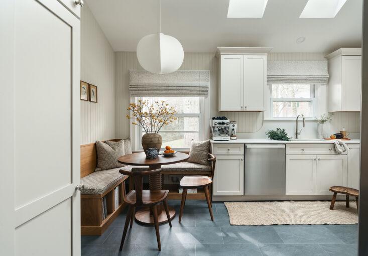 Eclectic kitchen with Shaker cabinets blending traditional and modern influences.