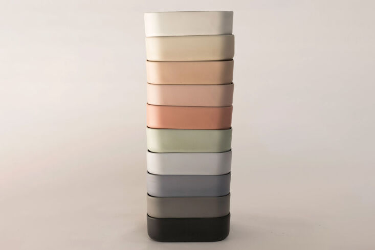 A minimalist surface mount concrete sink in a muted earth tone.