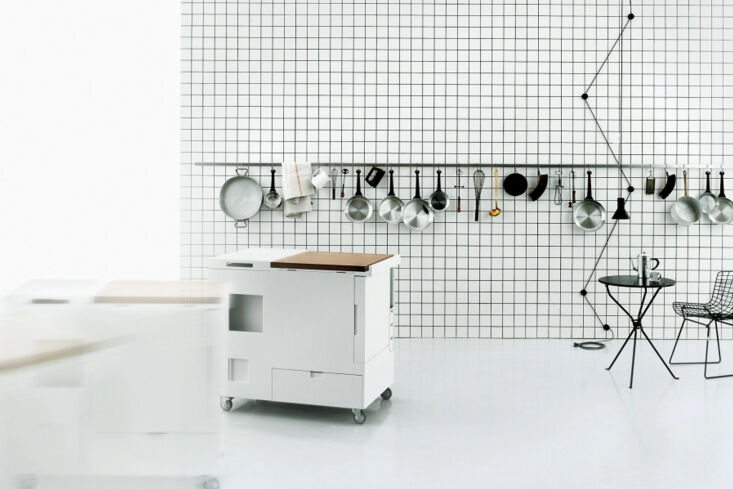 The Boffi Minikitchen white cart featuring a compact built-in refrigerator and storage compartments.