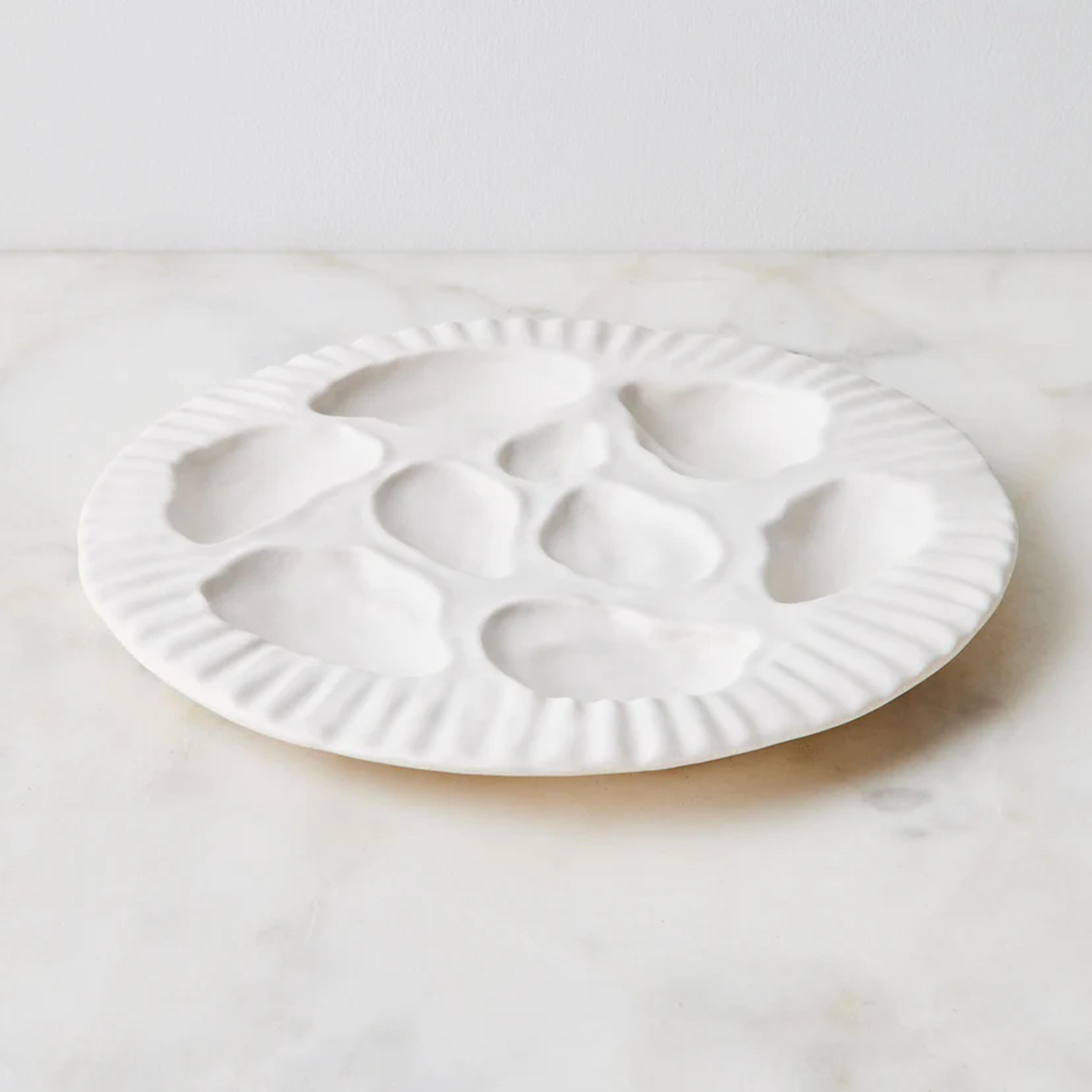 Handmade ceramic Sin Oyster Platter with a unique wavy edge.