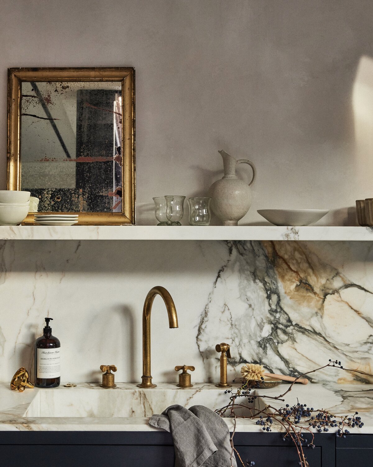 Graphic overlay of chic cleaning essentials against a soft beige background.