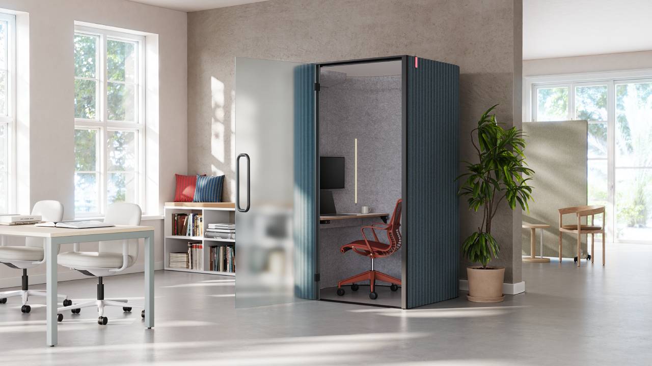 Close-up of a Bay Work Pod with frosted glass under soft natural light, highlighting the interior chair.