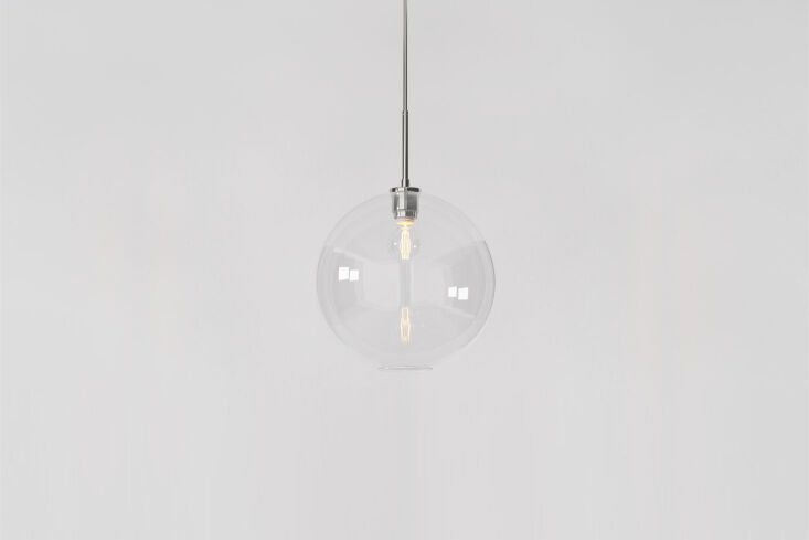West Elm Sculptural Glass Pendants in various shapes including globe and cylinder.