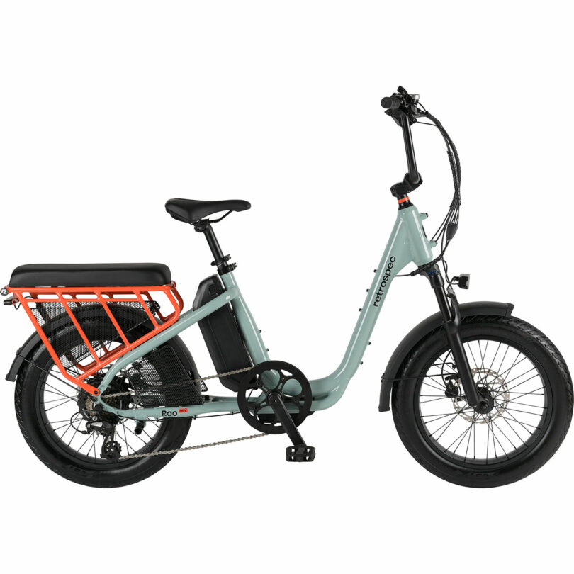 A profile shot of a matte gray electric cargo bike with a minimalist frame and rear rack.