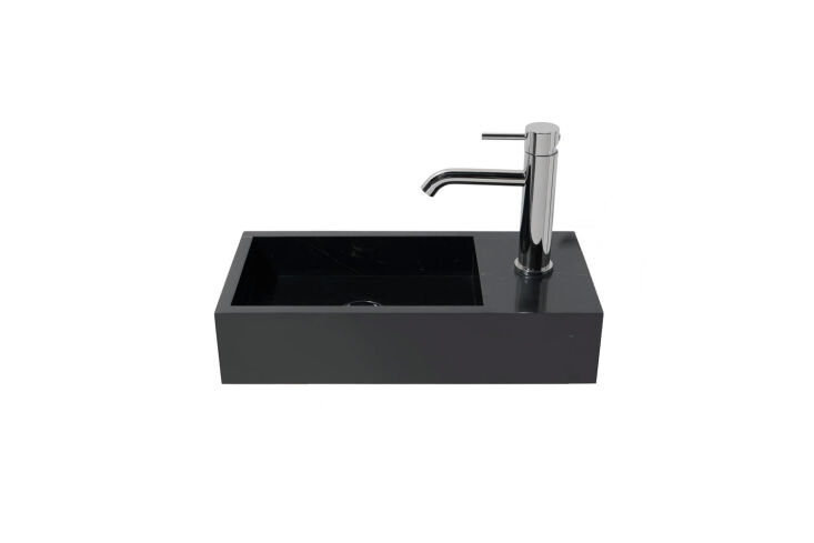 A luxurious black marble rectangular sink with unique stone textures.