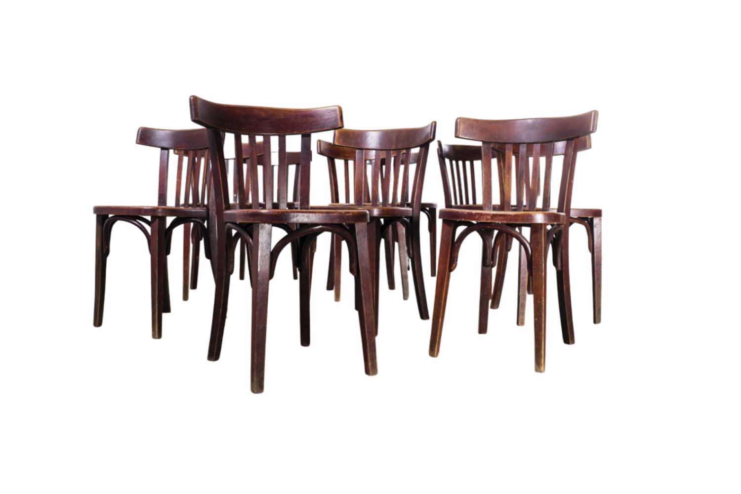 A set of vintage-style Fischel French Brentwood saddle back dining chairs.