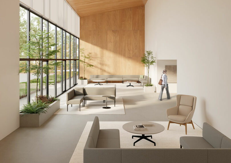 A minimalist and bright office lobby featuring Keilhauer furniture and large windows.