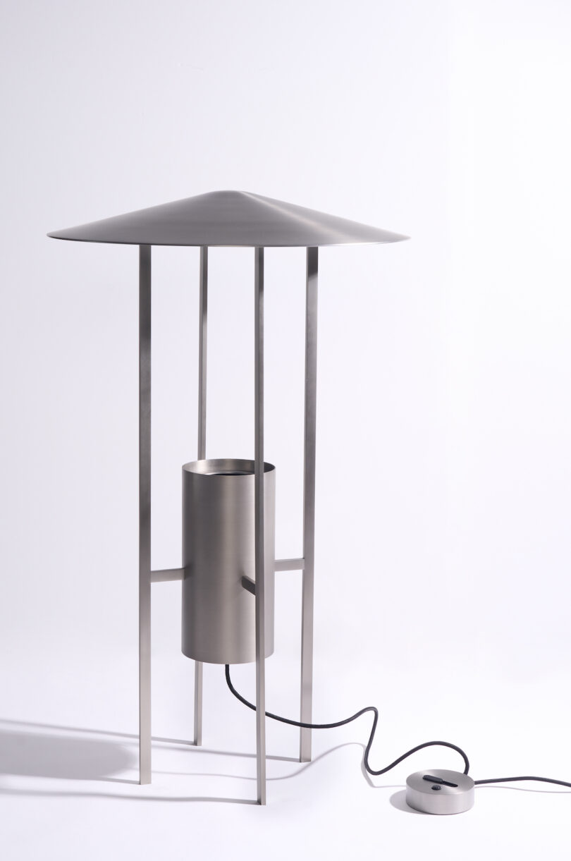 Close-up of the metallic finish and structural supports of the 1953 floor lamp reissue.