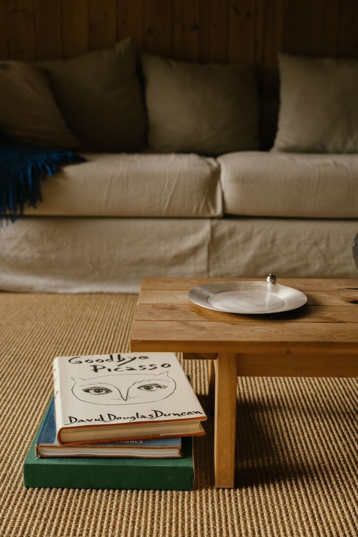 Close-up of sisal carpeting on the floor with a silver decorative platter.