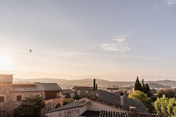 A scenic view of the lush Mediterranean landscape from the farmhouse terrace.