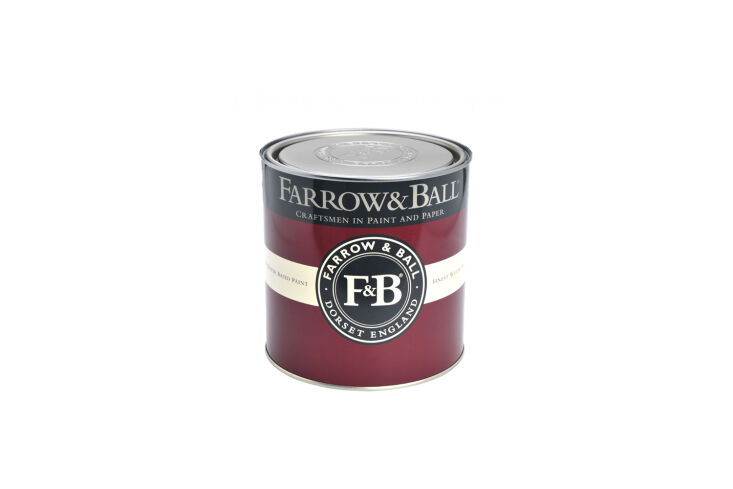 A close-up of a burgundy Farrow and Ball paint can.