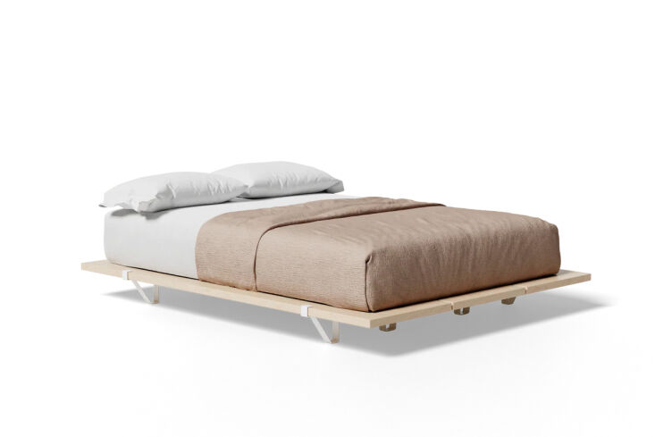 A low-profile wooden platform bed frame without a headboard.
