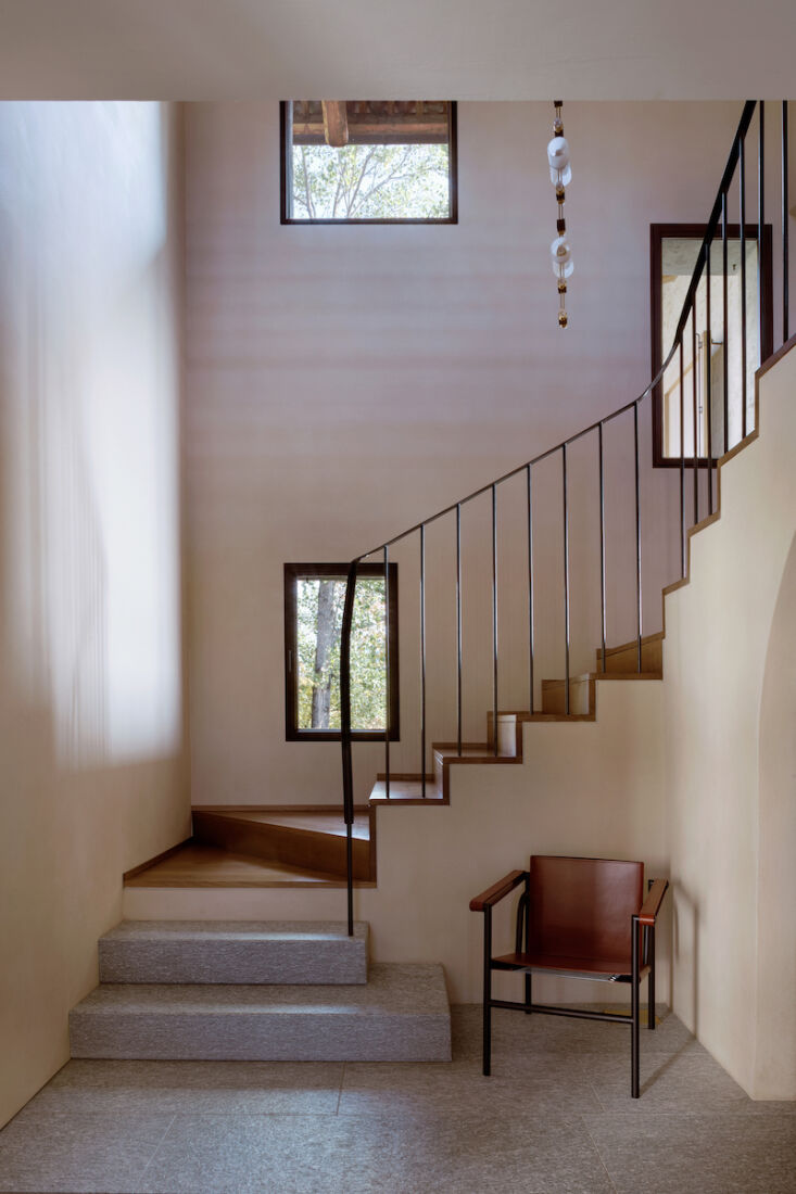 Interior view of the redirected staircase and the increased overhead volume of the entrance hall