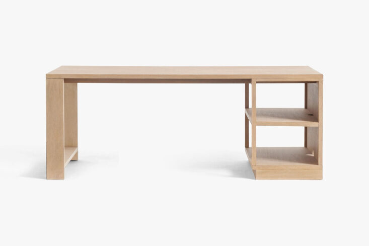 A built-in plywood desk designed for a compact 270-square-foot Parisian flat.