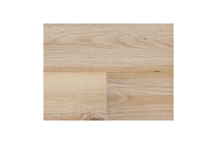 Close-up of whitewashed wood flooring in a light-filled room.