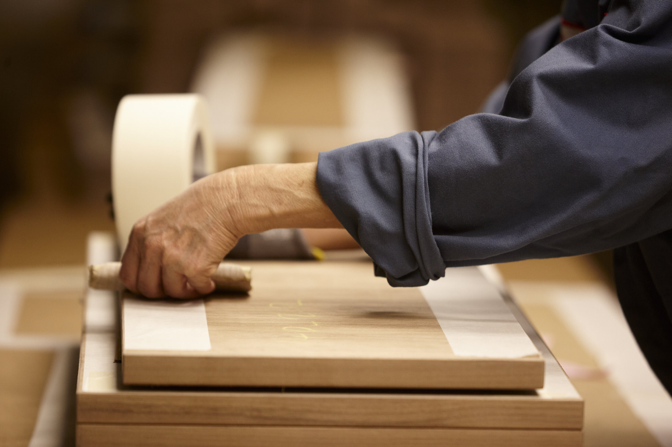 Close-up of polished natural wood grain used in Knoll furniture.