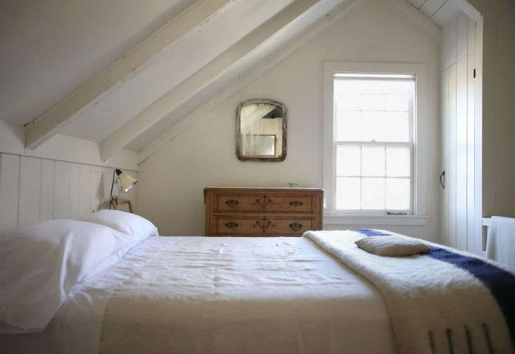 Bright white Sferra sheets on a bed, looking pristine after summer use.