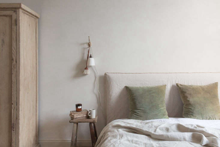 A collection of artisanal objects and ceramics with textured surfaces and natural patina.