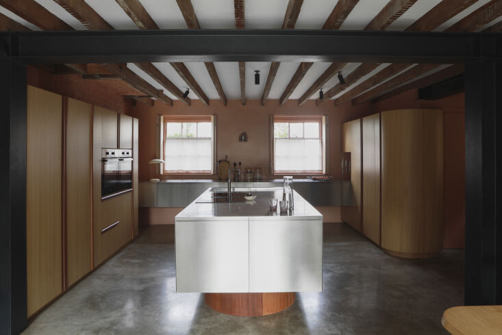 Custom oak and sapele wood kitchen island designed to look like furniture.