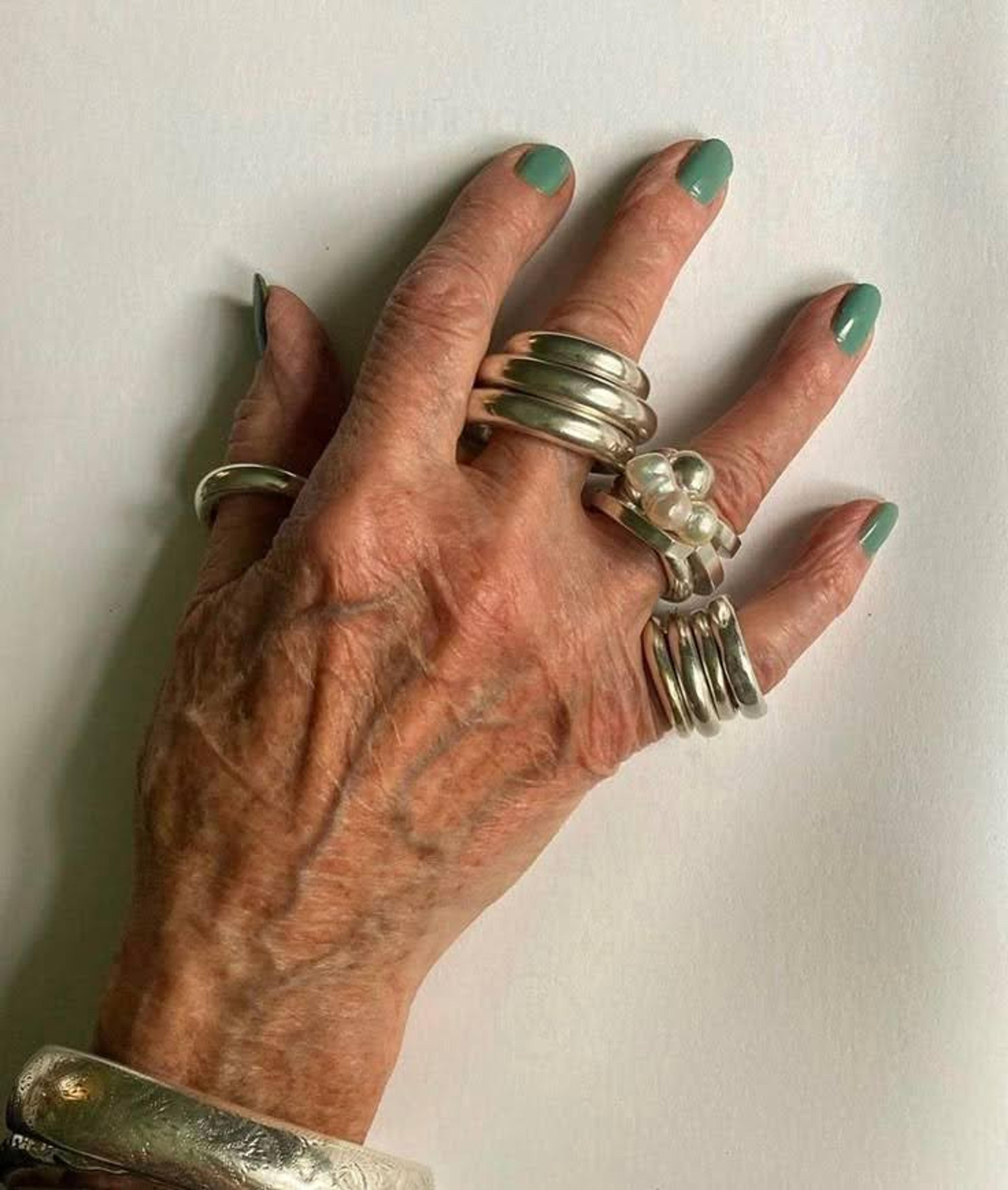 A sculptural gold ring with artistic metalwork