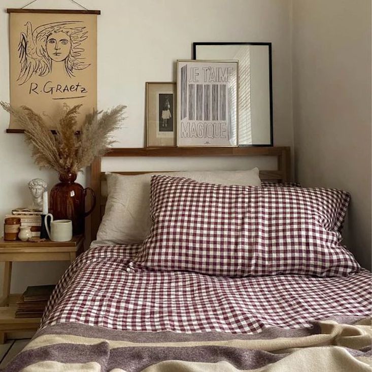 The Berry Gingham Linen Bedtime Bundle from Piglet in Bed styled on a bed.