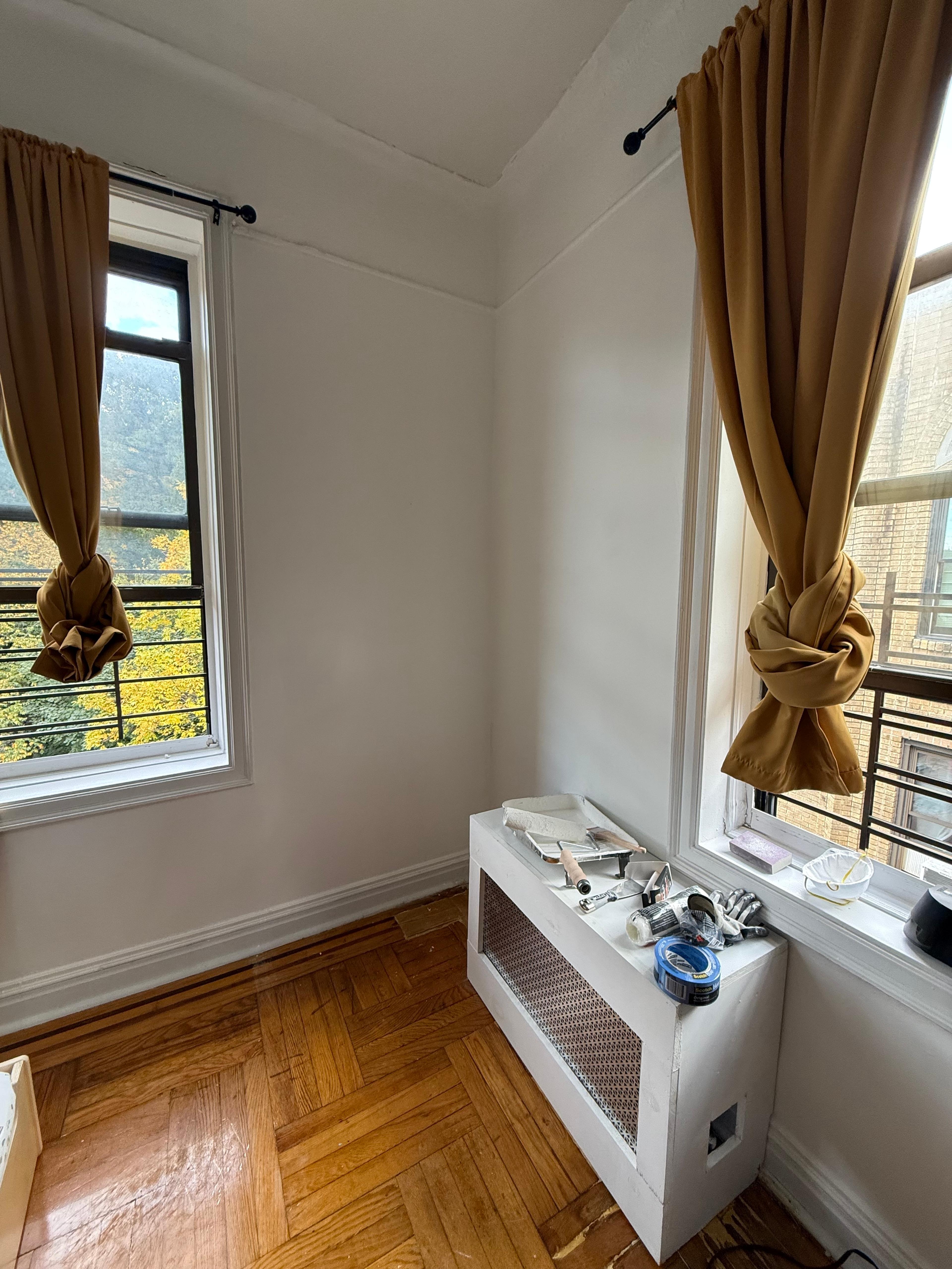 A small, tidy corner of a living room designated for a child's play area.
