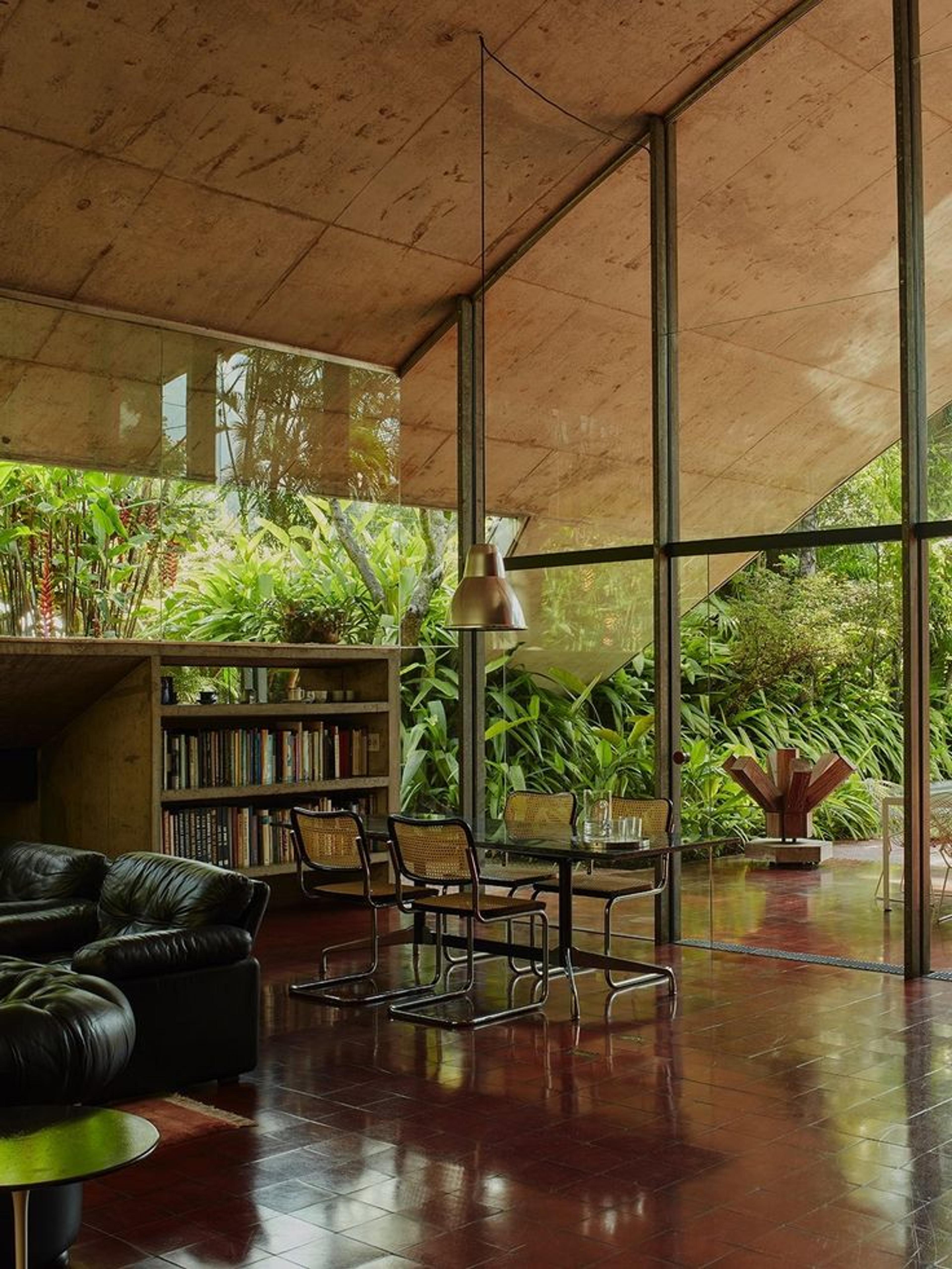 A moody library corner with dark wood bookshelves and a cozy, eerie atmosphere.