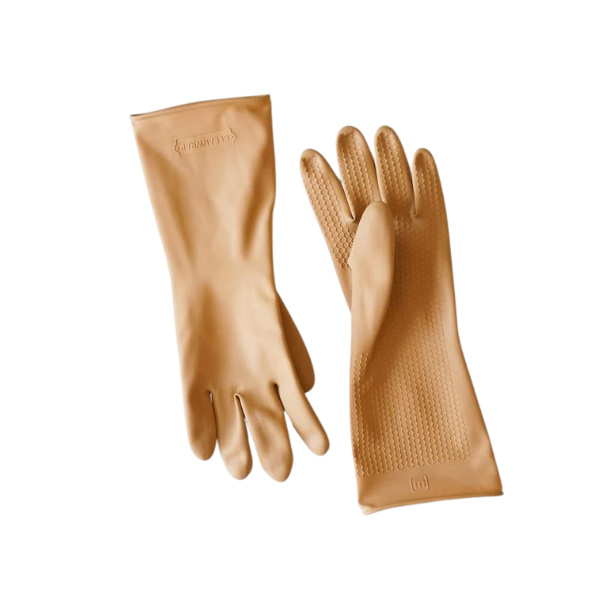 A kitchen sink area styled with a marble soap tray and amber glass bottles.