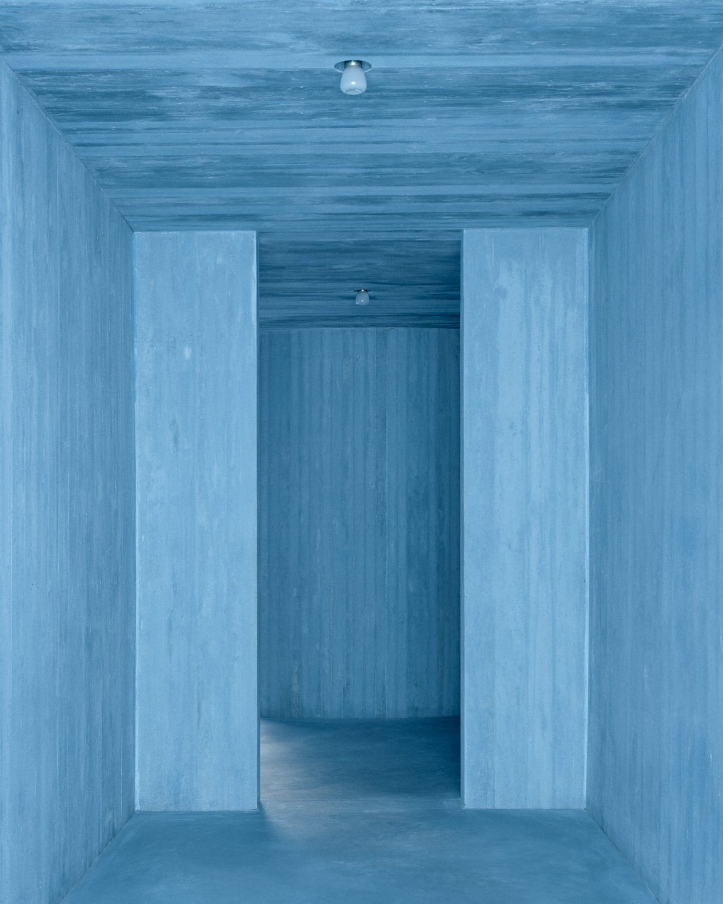 Minimalist view of the intersection of blue planes and beams within the house.