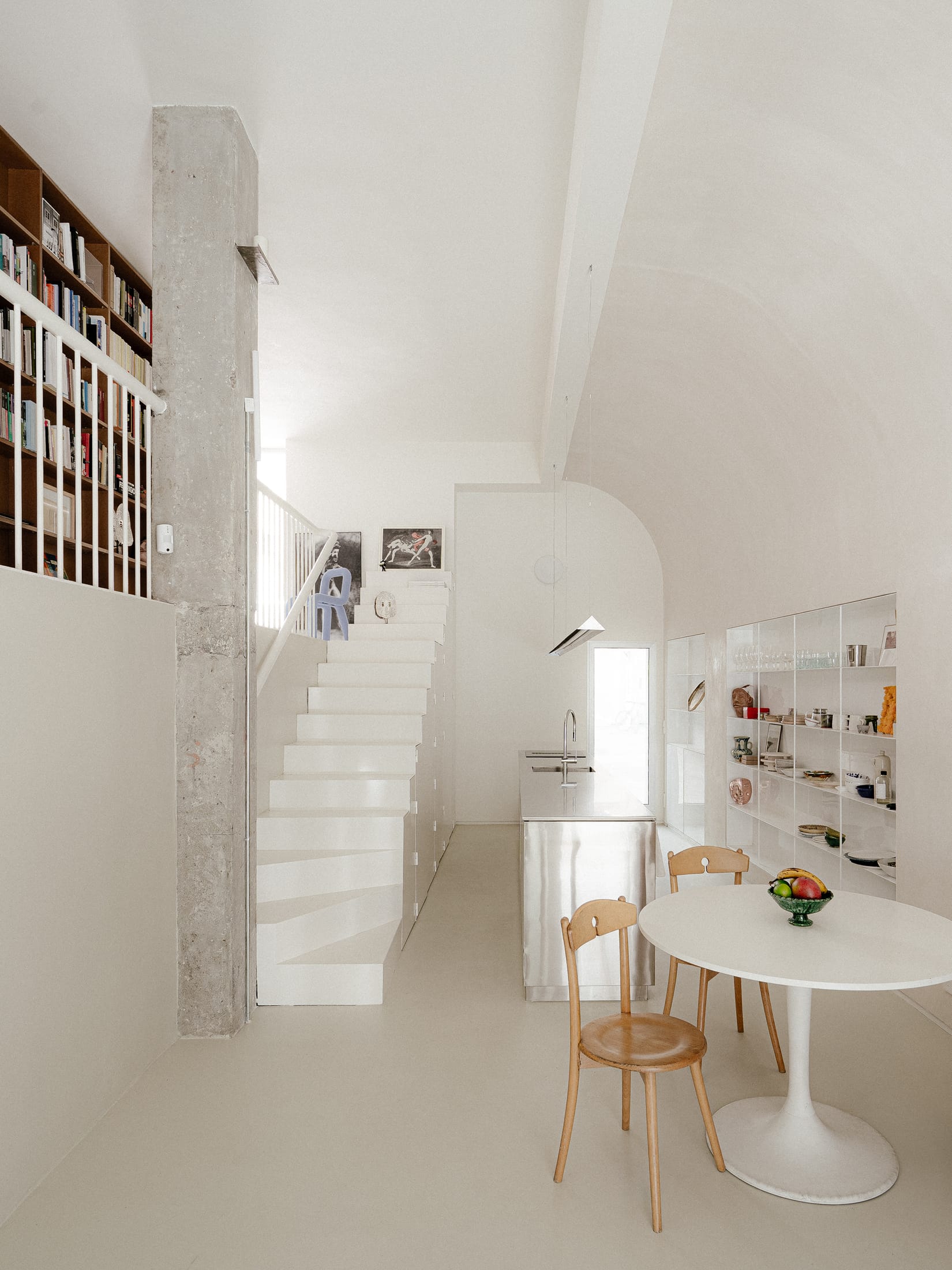 Overall interior view of the renovated shop-to-home project in Madrid by BURR studio.