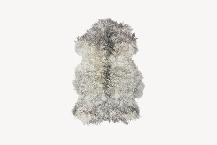 A soft gray Gotland sheepskin draped over a chair for texture.