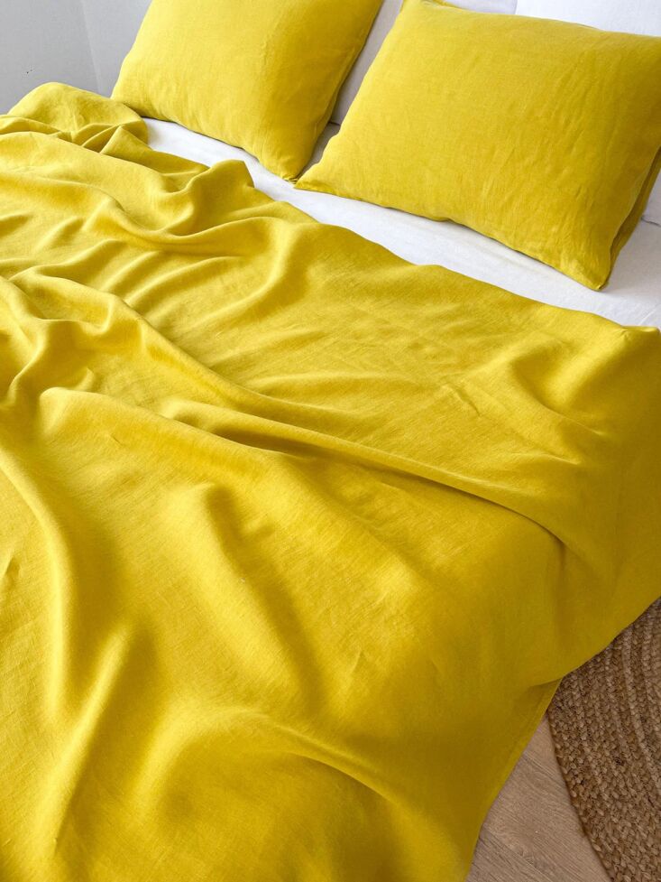 A vibrant mustard yellow Linen Summer Cover from Linen Notes.