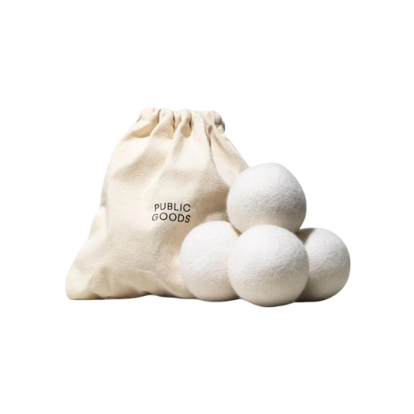 A close-up of a designer fabric shaver on a chunky knit wool sweater.