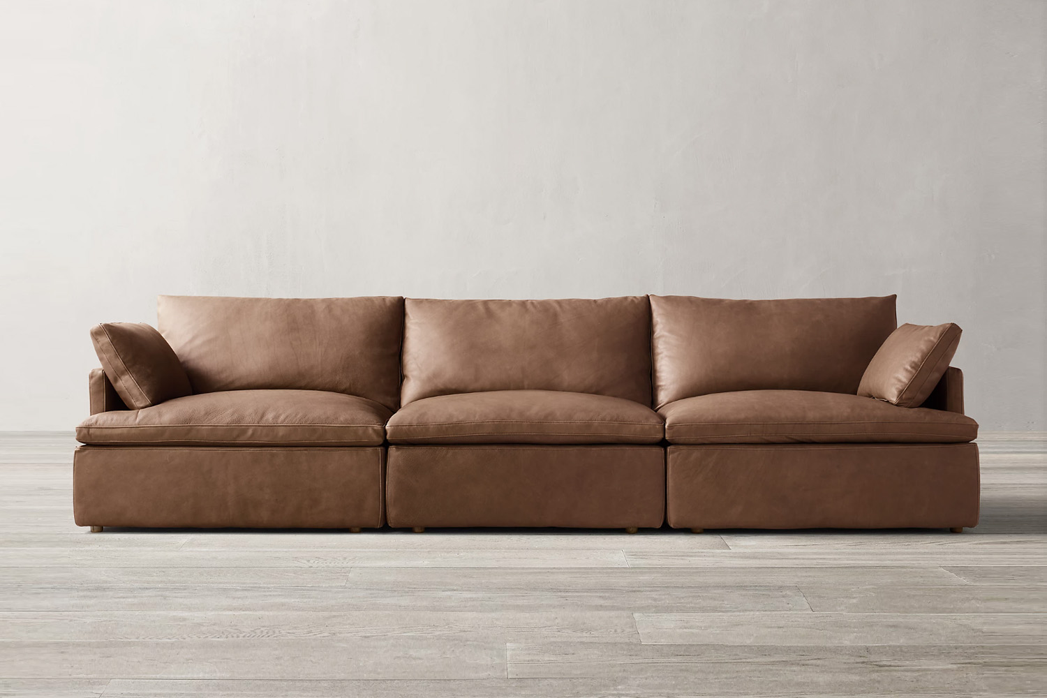 RH Cloud Track Arm Modular Leather Sofa in a contemporary room.