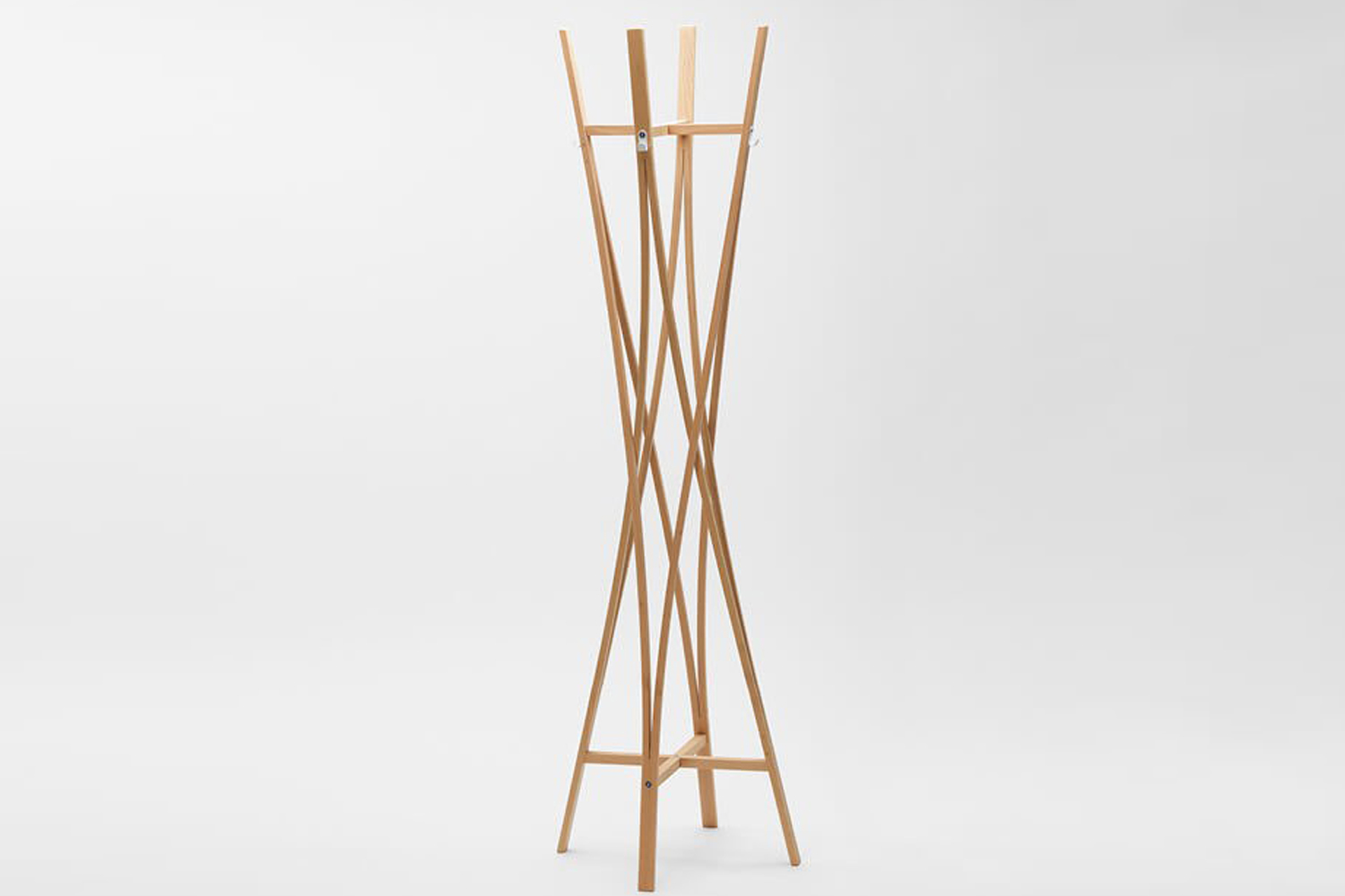 The Tra Coat Rack by Tomoko Azumi featuring a unique helix shape made of beech wood.