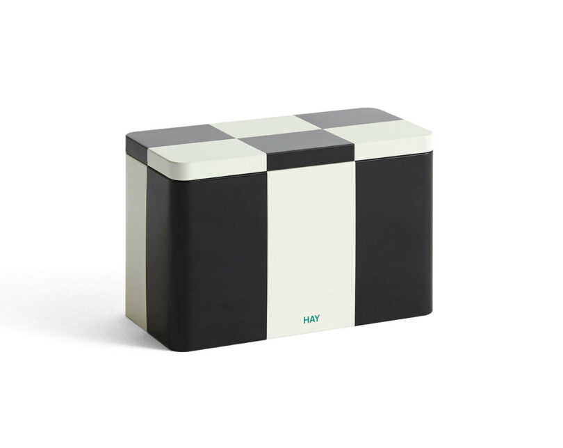 Checkered metal storage tin with green HAY branding and a white vertical stripe.