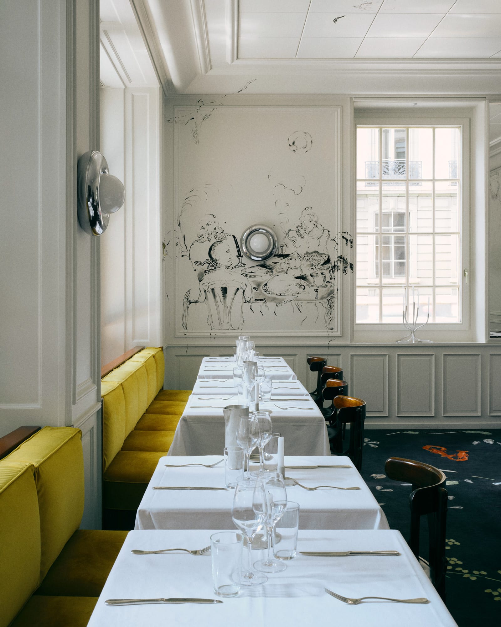 Wide shot of the main dining room showing 100% retention of original 1950s walls and timber paneling.