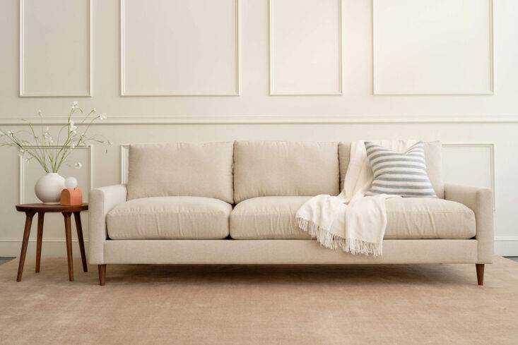 Minimalist cream-colored Medley Lala Sofa in a bright living room.