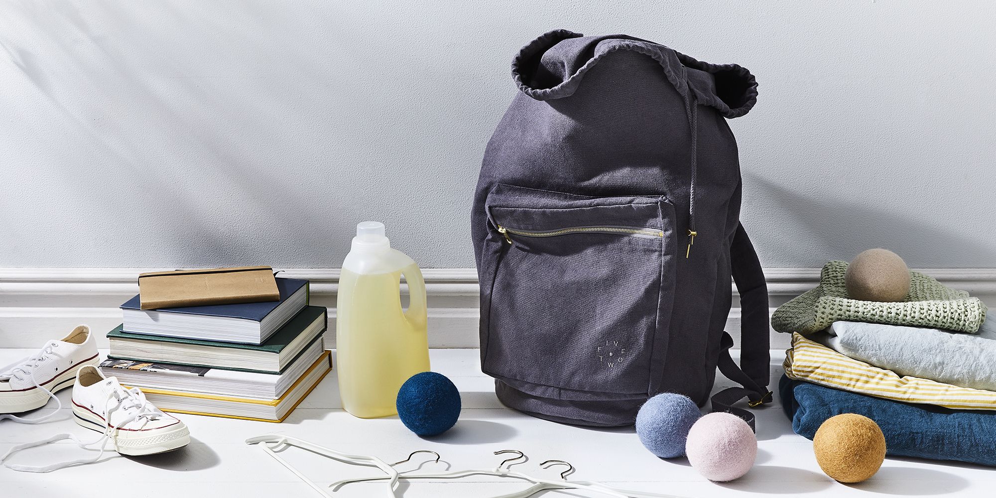 A flat lay of graduation gifts including practical tools and dorm room accessories.