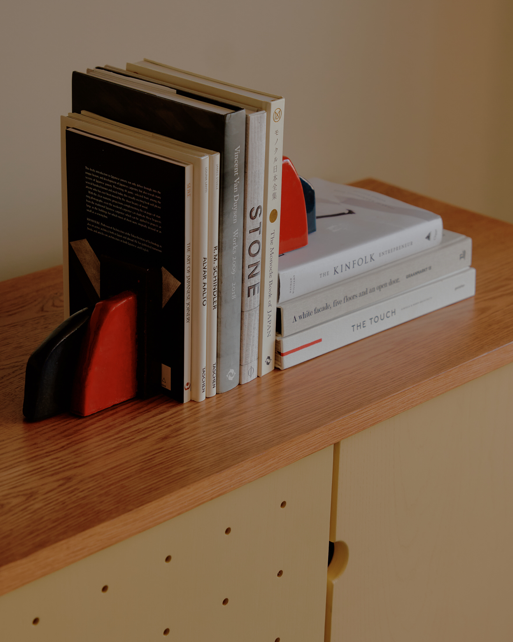 Custom rhombus-shaped boardroom table with intricate wood joinery.