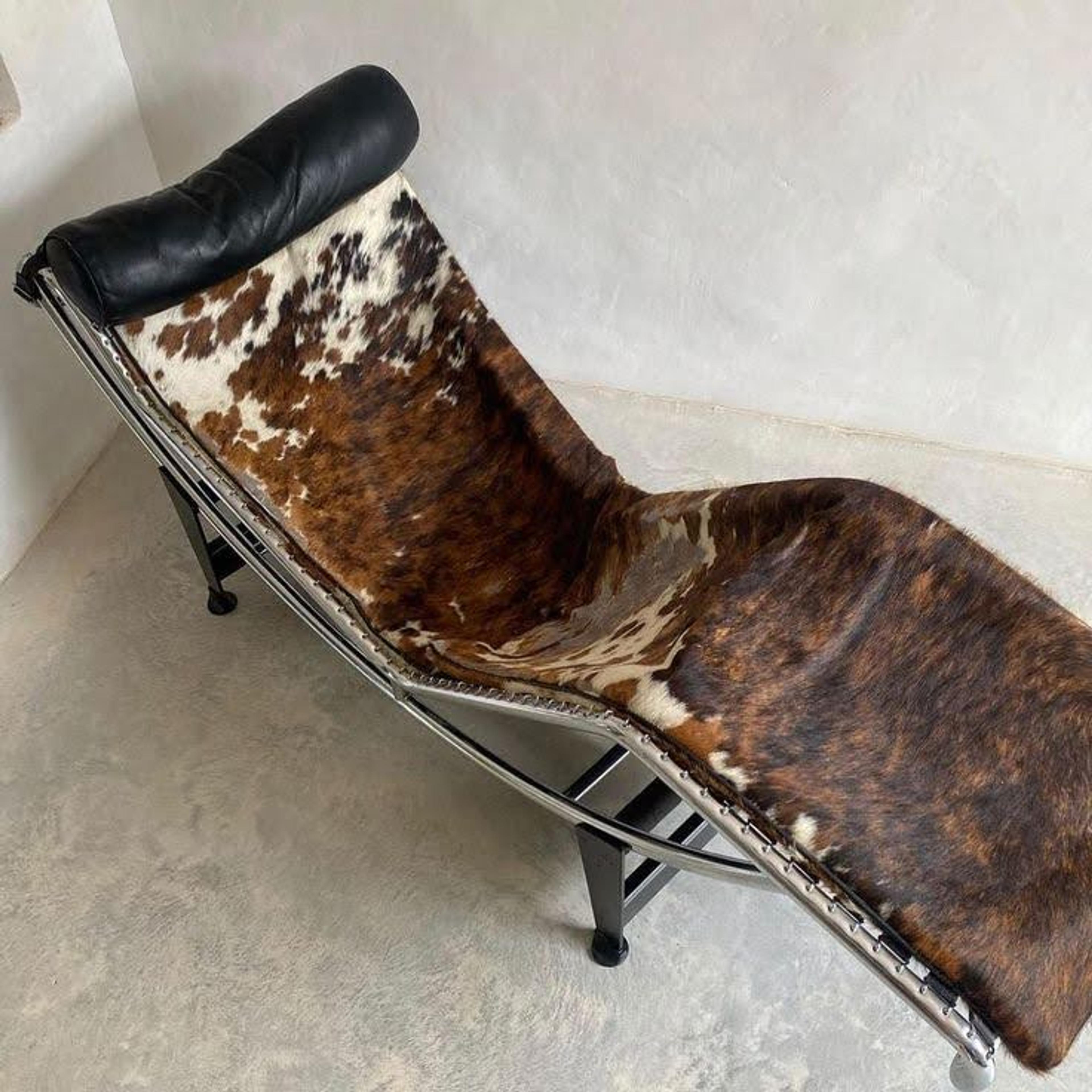A luxury lounge chair upholstered in black and white cowhide