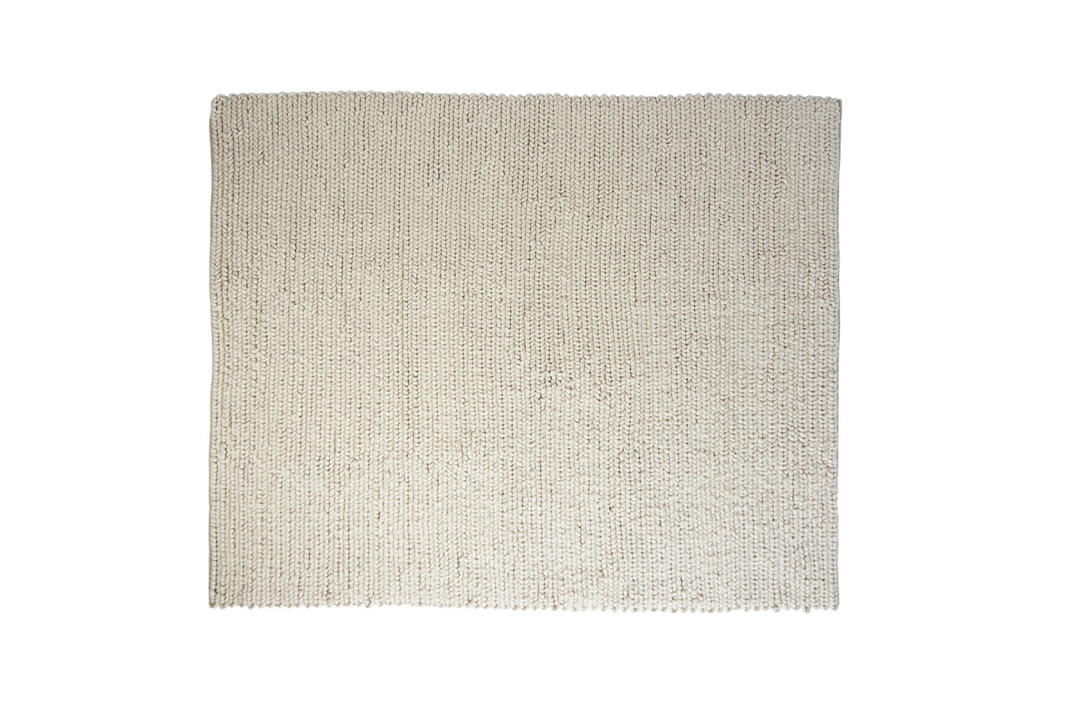 A textured off-white braided wool rug showcasing high-quality sustainable fiber.