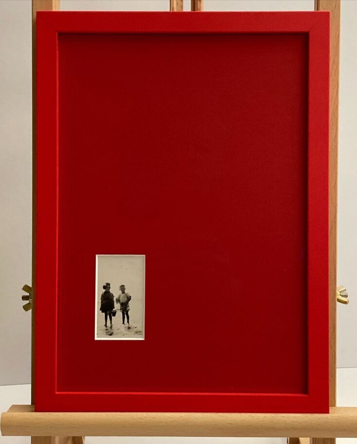 A contemporary painting framed in a bright, monochromatic yellow frame and mat.